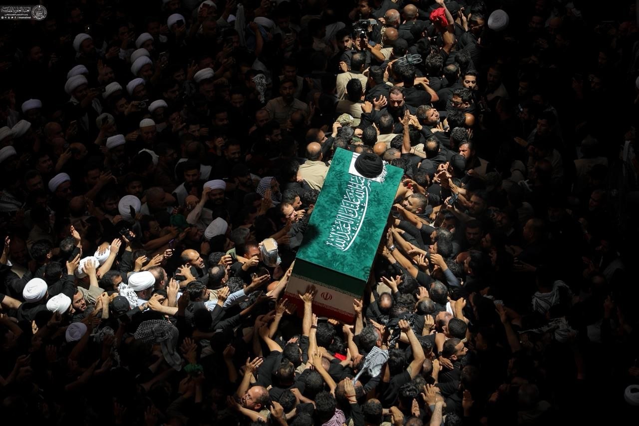 The coffins carried around the shrine of Imam Ali