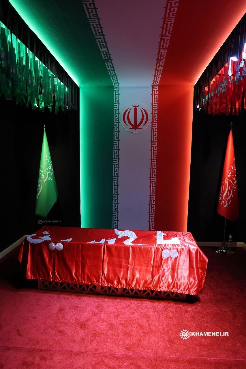 Flag of Imam Hussain shrine over the body of Martyr Khamenei